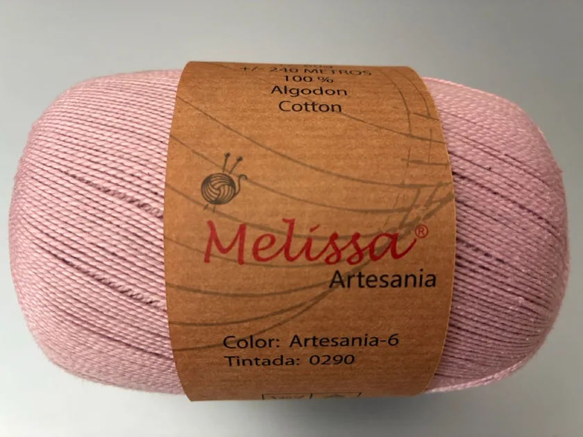A ball of Melissa Algodon Artesania cotton in Artesania-6 pink, the yarn the sample is crocheted in